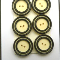 6 black cream buttons