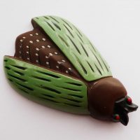 brown green bug clip celluloid