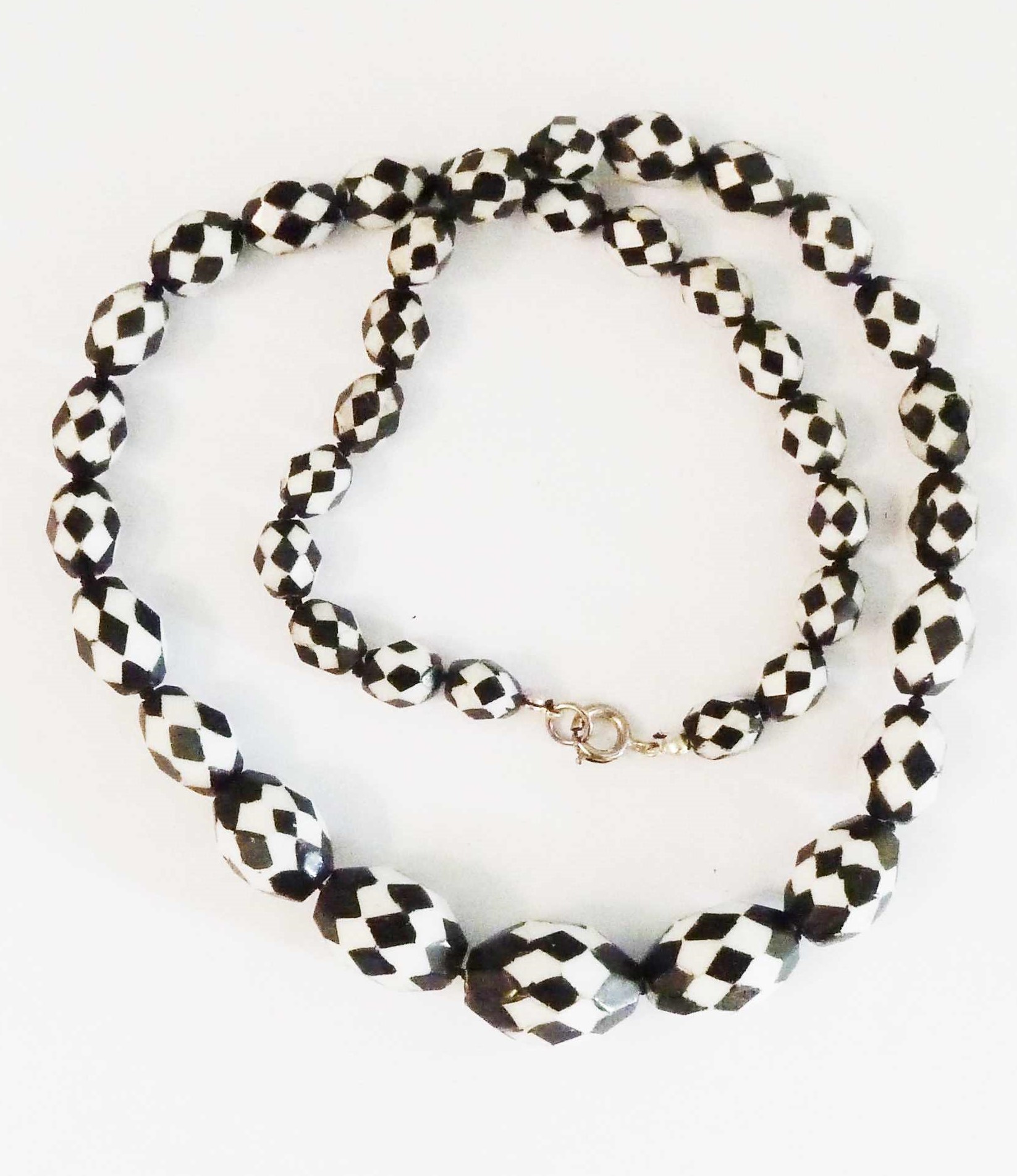 VINTAGE BLACK AND WHITE GLASS BEADS CUT INTO A DIAMOND PATTERN - BLACK OVER  WHITE