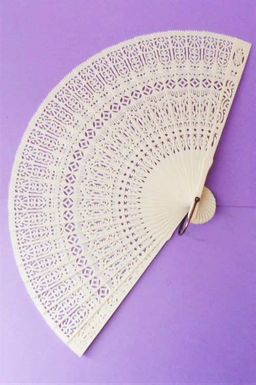 cream celluloid fan