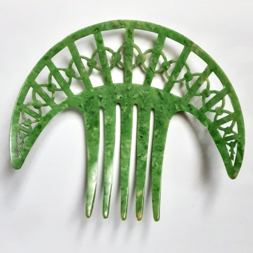 green celluloid hair comb back