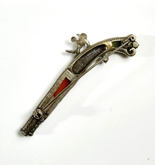 Miracle pistol brooch back