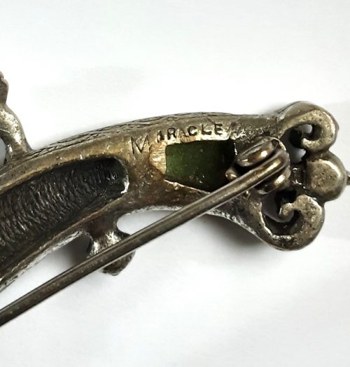 Miracle pistol brooch mark