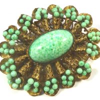 Neiger brooch green beads on wire